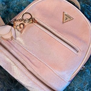 Guess pink velvet backpack.